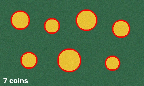 Seven coins on a tray outlined in red with the text 7 coins